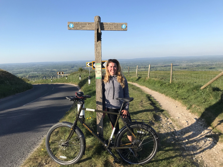 Leaning against the signpost for dear life at the top of Ditchling beacon 